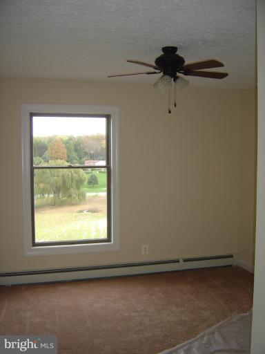 18002 Marshall Mill Road Hampstead, MD 21074 - Photo 24 of 30 a view of an empty room with a window