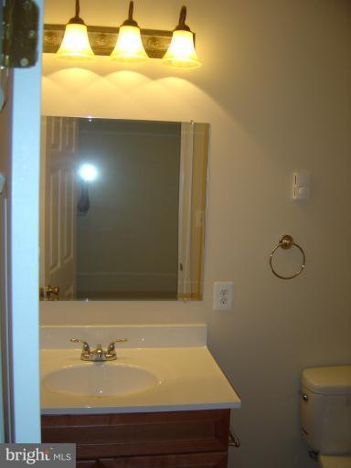 18002 Marshall Mill Road Hampstead, MD 21074 - Photo 5 of 30 a bathroom with a sink and a mirror