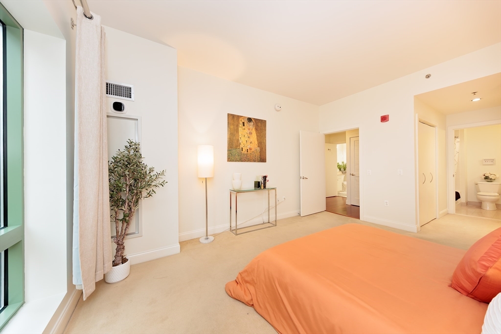 20 Second Street, Unit 222 Cambridge, MA 02141 - Photo 13 of 38 a spacious bedroom with a bed and a closet