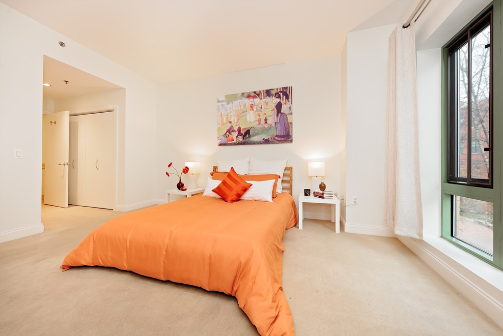 20 Second Street, Unit 222 Cambridge, MA 02141 - Photo 14 of 38 a bedroom with a bed and a large window