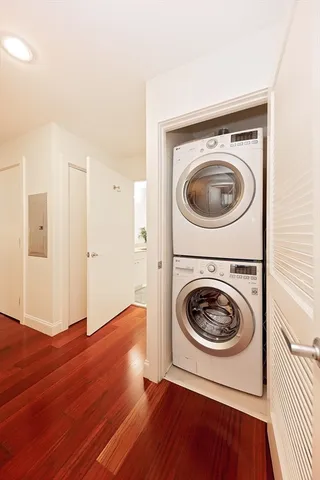 a view of a hallway with washer and dryer