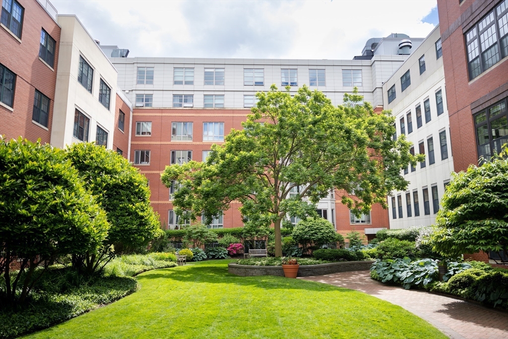 20 Second Street, Unit 222 Cambridge, MA 02141 - Photo 23 of 38 a front view of a multi story building with yard and green space