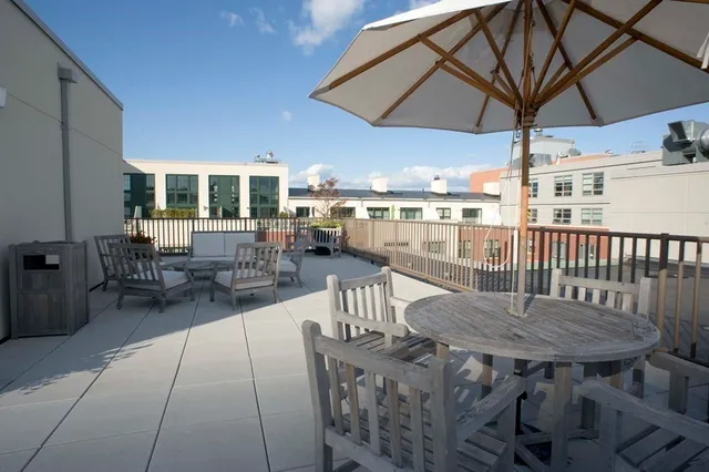 a view of a terrace with furniture and chandelier