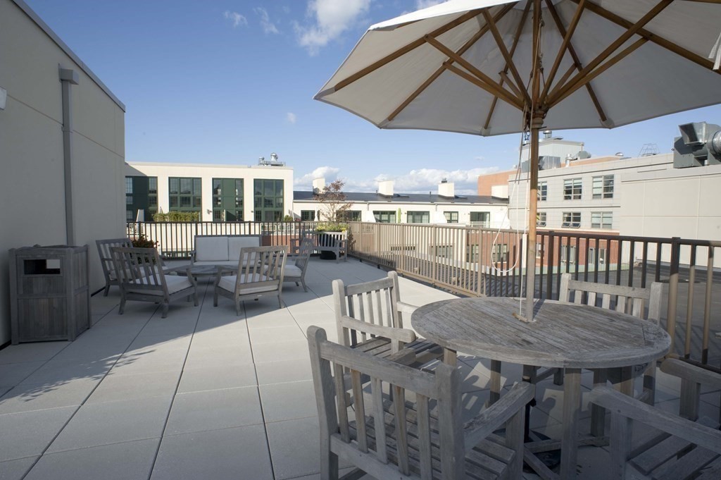 20 Second Street, Unit 222 Cambridge, MA 02141 - Photo 31 of 38 a view of a patio with a table and chairs