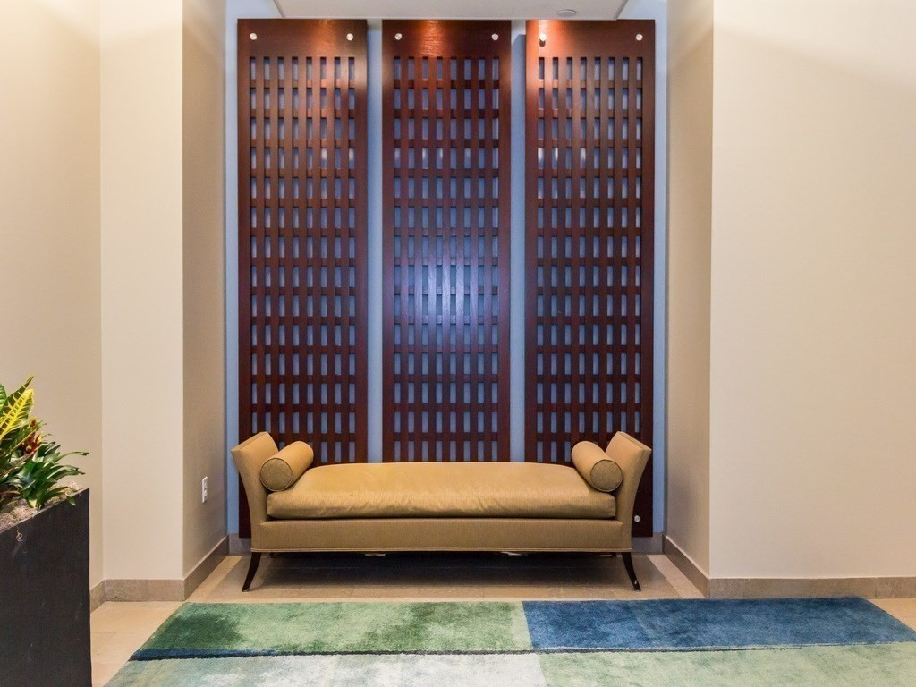 20 Second Street, Unit 222 Cambridge, MA 02141 - Photo 36 of 38 a bedroom with furniture and a rug