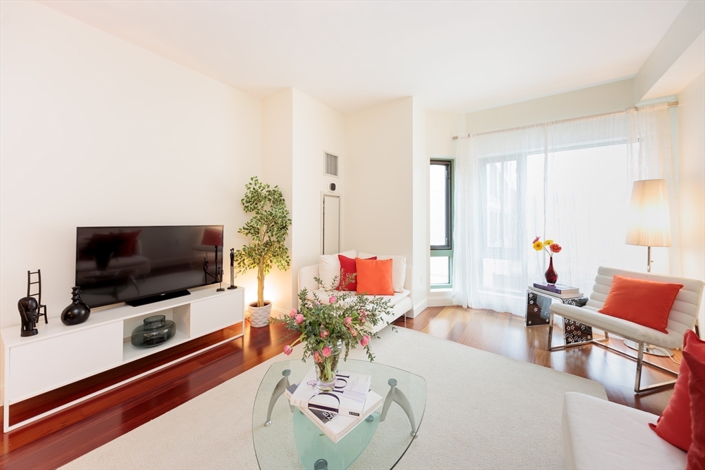 20 Second Street, Unit 222 Cambridge, MA 02141 - Photo 4 of 38 a living room with furniture and a flat screen tv