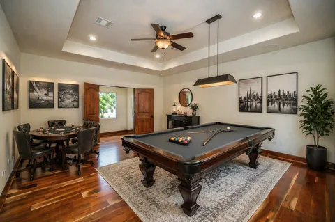 a bedroom with a large bed and a flat screen tv