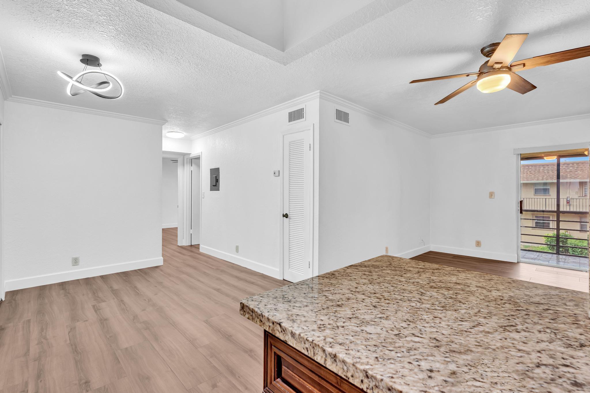 1291 Northwest 13th Street, Unit 445D Boca Raton, FL 33486 - Photo 26 of 50 wooden floor in an empty room