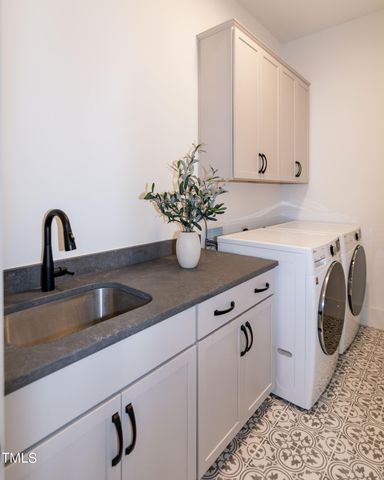 a living room with furniture wooden floor and a large window