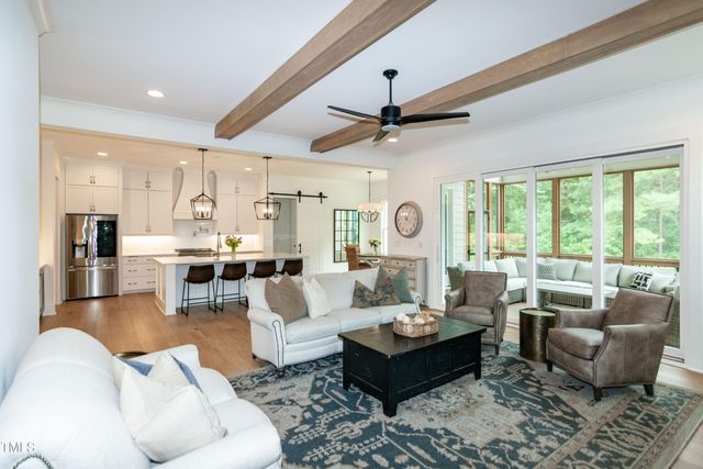 a view of a livingroom with furniture and window