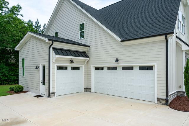 a view of a workspace with furniture and wooden floor