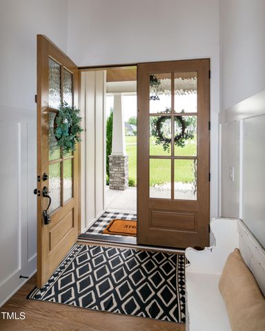 a bed room with a bed and a chandelier