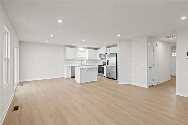 a view of kitchen with wooden floor