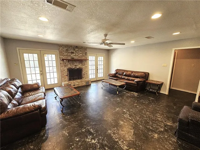 a living room with furniture or fireplace and a wooden floor