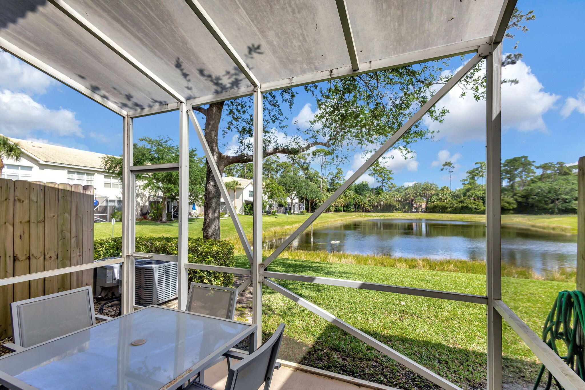 1103 Woodfield Road Greenacres, FL 33415 - Photo 29 of 44 Screened patio