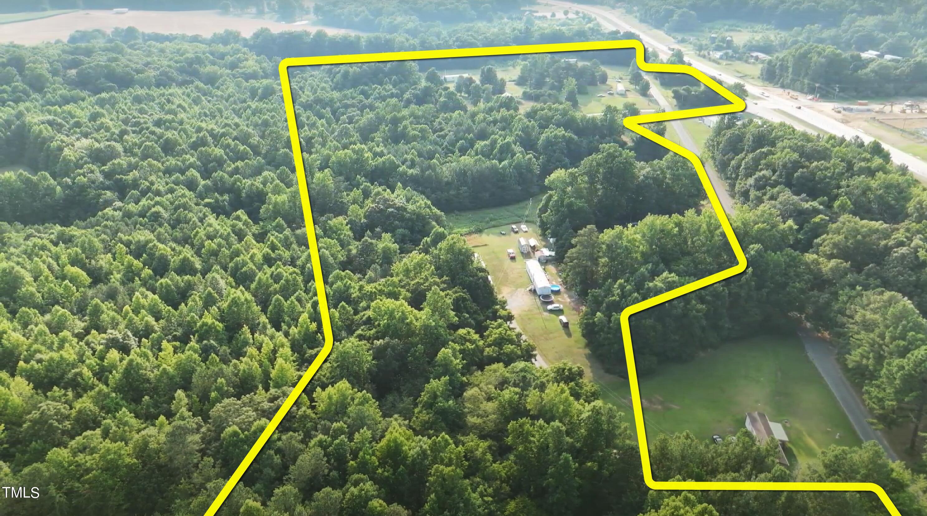 505 Graham Moore Road Staley, NC 27355 - Photo 1 of 12 a view of a yard with swimming pool