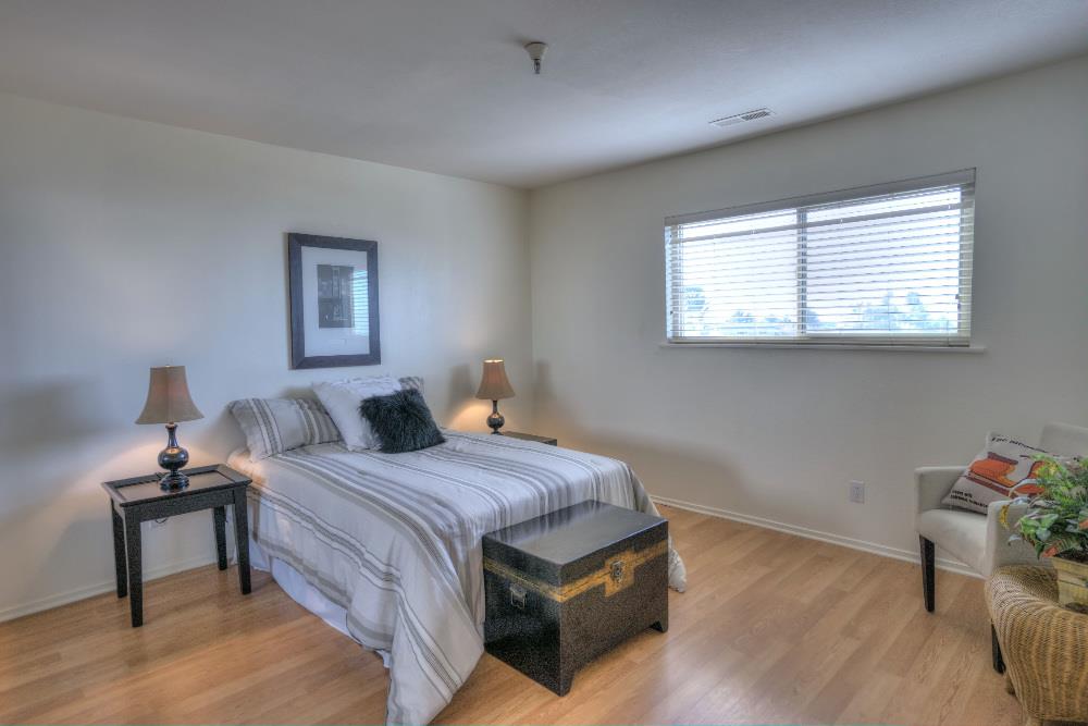 534 Monterey Road Pacifica, CA 94044 - Photo 14 of 20 a bedroom with a bed and a window