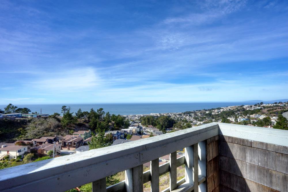 534 Monterey Road Pacifica, CA 94044 - Photo 3 of 20 a view of a city skyline from a balcony