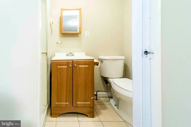 a bathroom with a toilet and a sink