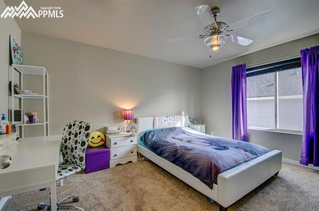 2405 Reed Grass Way Colorado Springs, CO 80915 - Photo 27 of 35 Secondary bedroom on upper level is spacious and includes a walk in closet.
