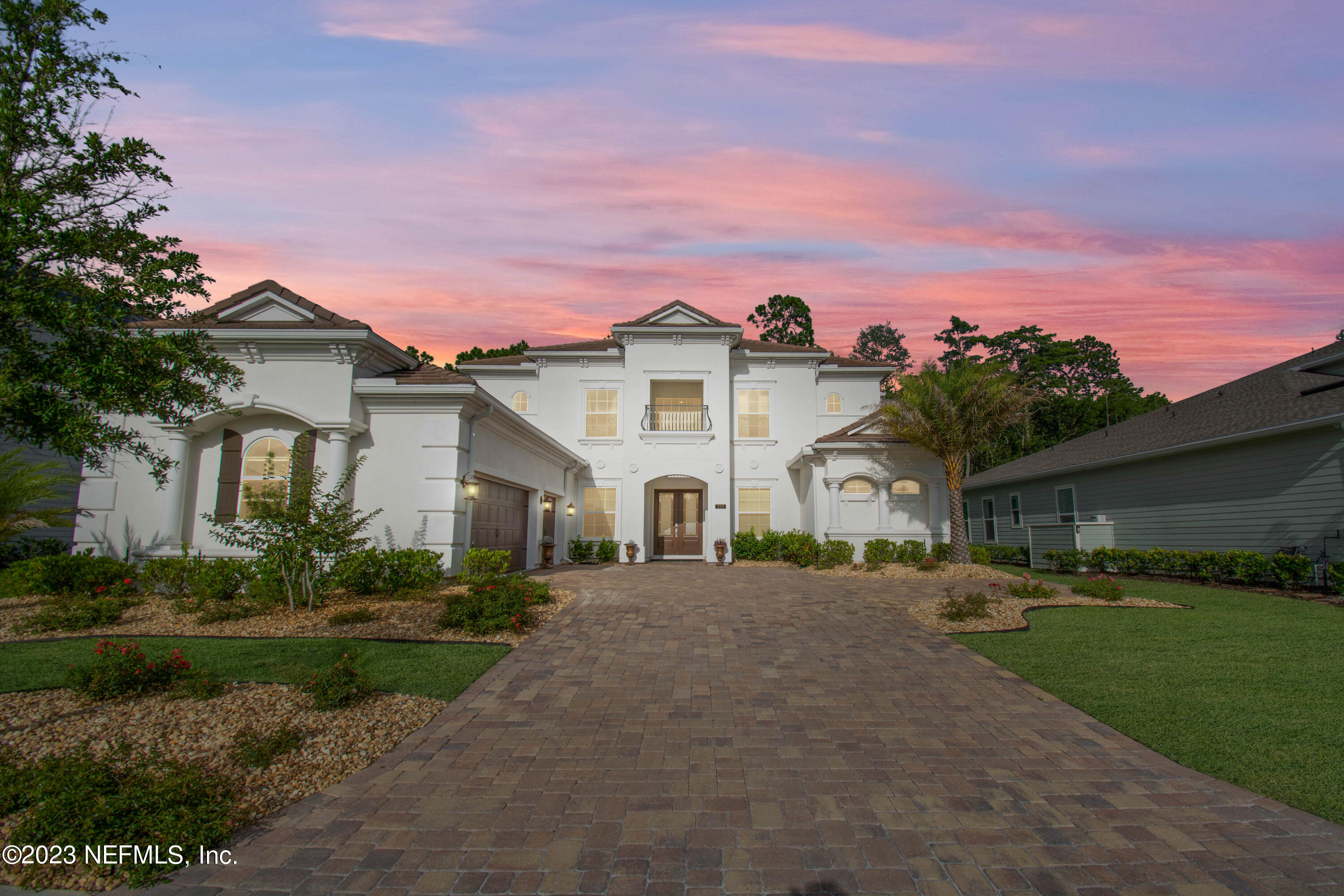 233 Aspinwall Parkway St. Augustine, FL 32095 - Photo 1 of 31 a front view of a house with a garden and yard