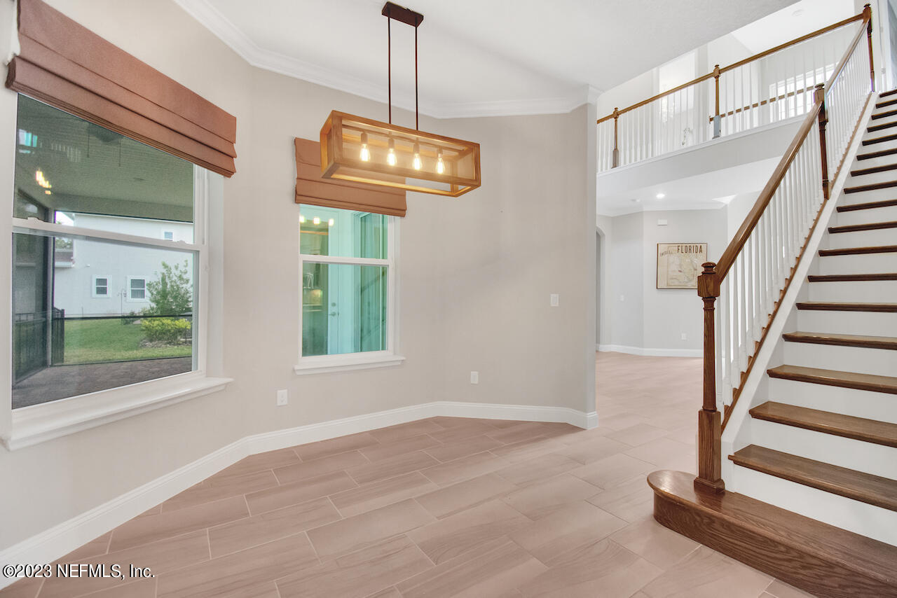 233 Aspinwall Parkway St. Augustine, FL 32095 - Photo 18 of 31 a view of an entryway with wooden floor and door
