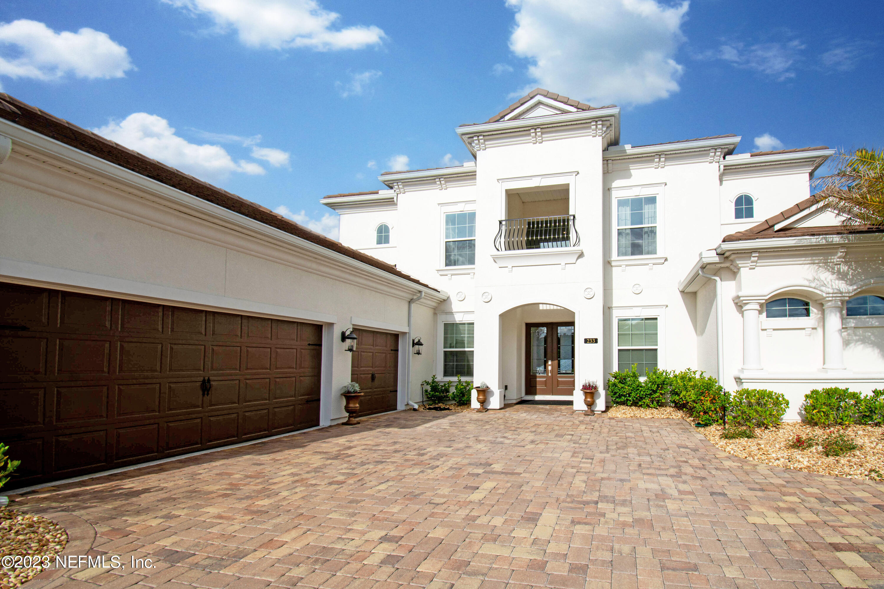 233 Aspinwall Parkway St. Augustine, FL 32095 - Photo 2 of 31 a front view of a house with a yard and garage