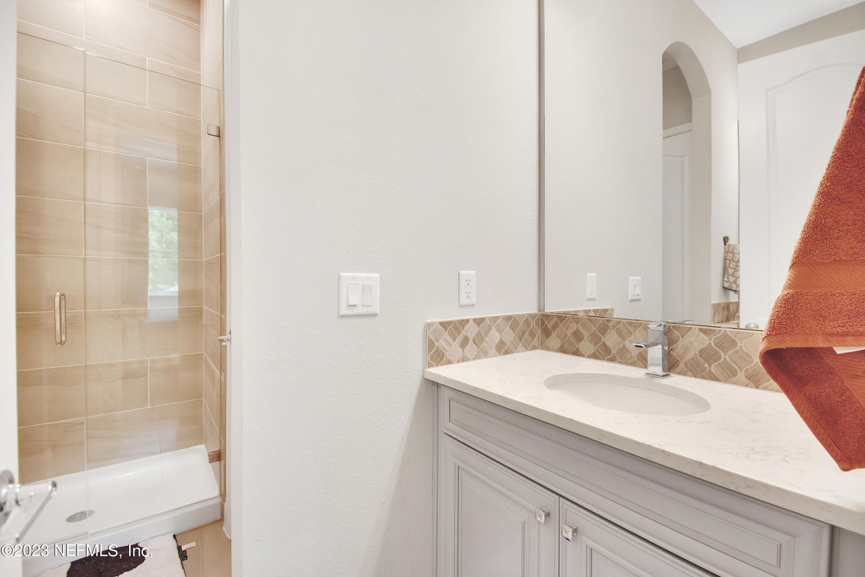 233 Aspinwall Parkway St. Augustine, FL 32095 - Photo 21 of 31 a bathroom with a sink and a mirror