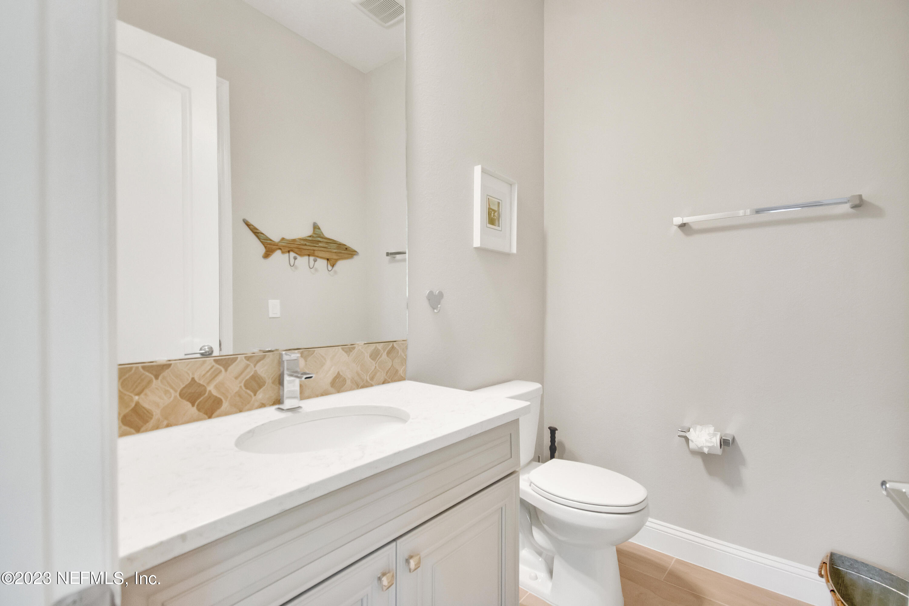 233 Aspinwall Parkway St. Augustine, FL 32095 - Photo 23 of 31 a bathroom with a sink and a toilet