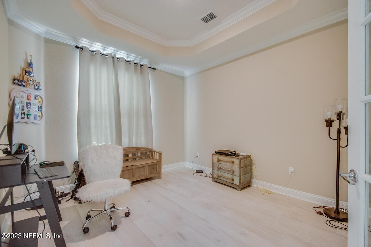 233 Aspinwall Parkway St. Augustine, FL 32095 - Photo 30 of 31 a room with a window and a chair