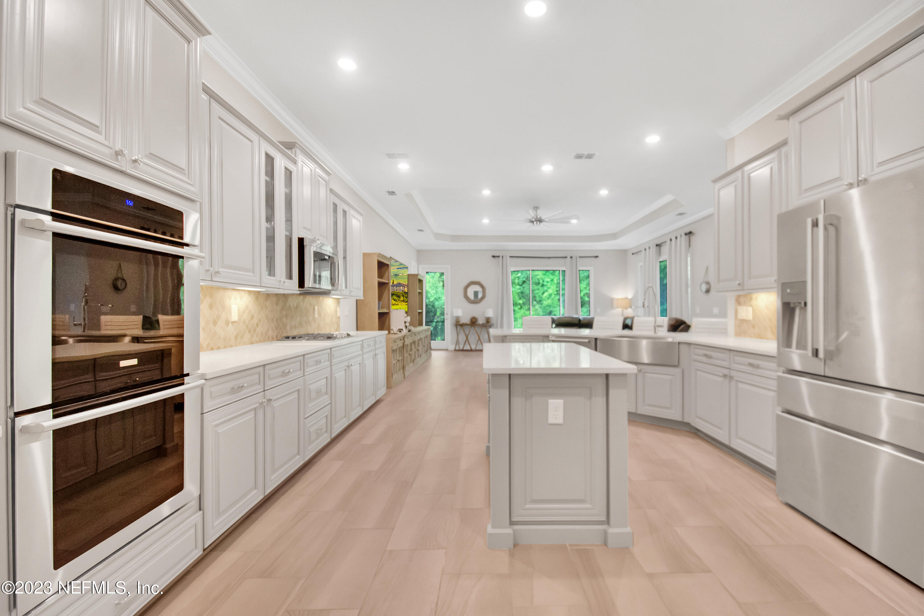 233 Aspinwall Parkway St. Augustine, FL 32095 - Photo 7 of 31 a kitchen with stainless steel appliances granite countertop a refrigerator and a stove top oven