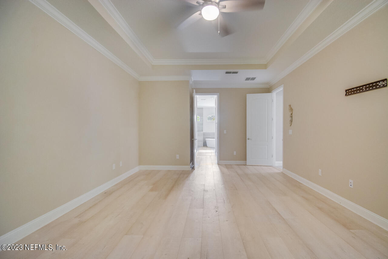 233 Aspinwall Parkway St. Augustine, FL 32095 - Photo 10 of 31 wooden floor in an empty room with a window