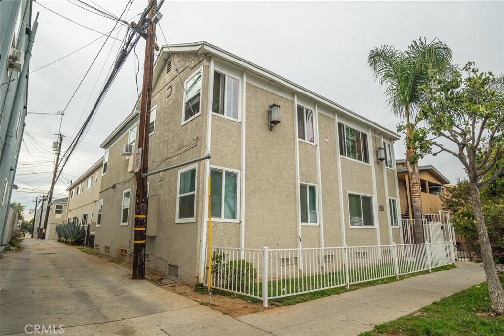 1415 Cedar Avenue Long Beach, CA 90813 - Photo 2 of 26 a front view of a house with a glass windows and yard