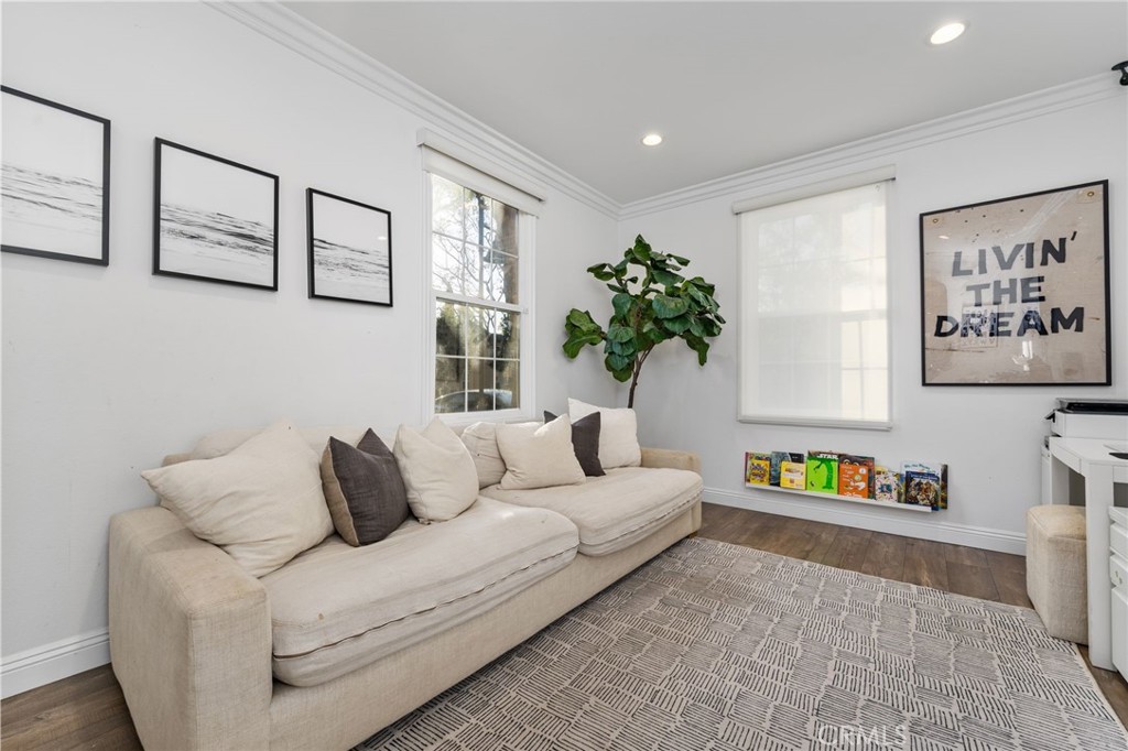 10 Bower Tree Irvine, CA 92603 - Photo 12 of 37 a living room with furniture and painting on the wall