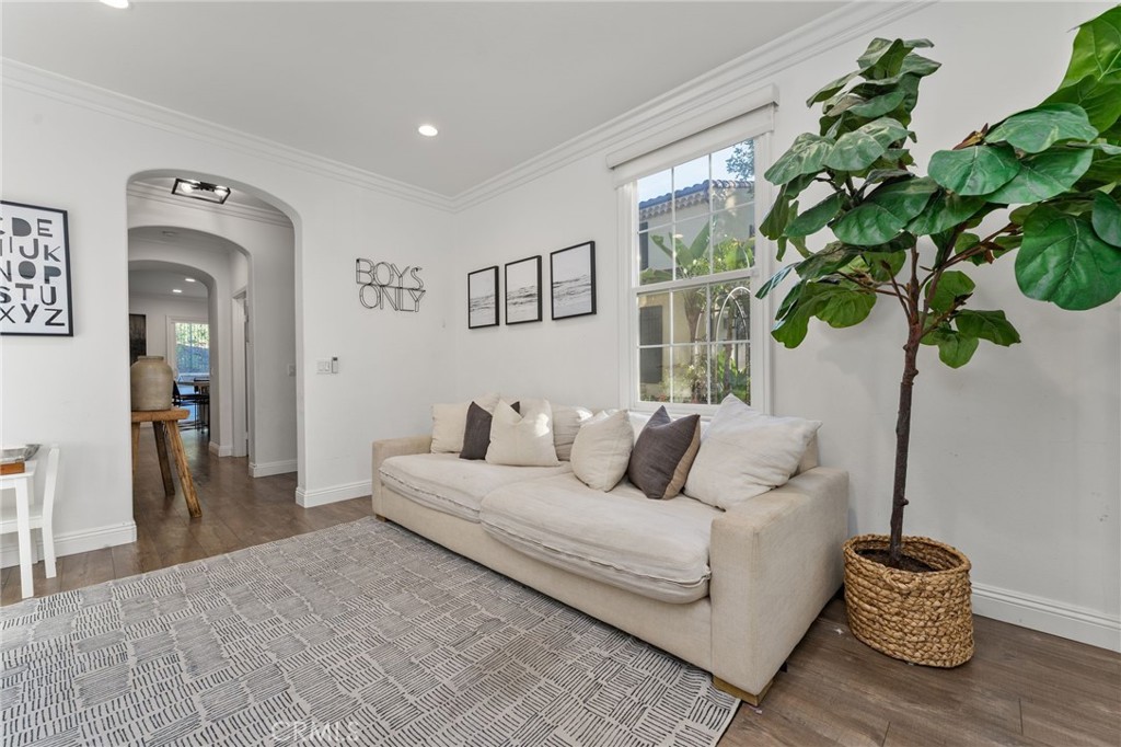 10 Bower Tree Irvine, CA 92603 - Photo 13 of 37 a living room with furniture a potted plant and a wooden floor