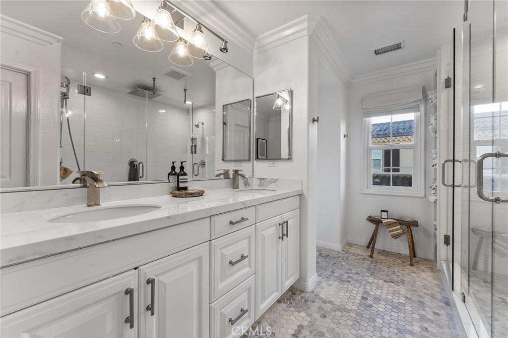 10 Bower Tree Irvine, CA 92603 - Photo 18 of 37 a bathroom with a sink a toilet and a mirror