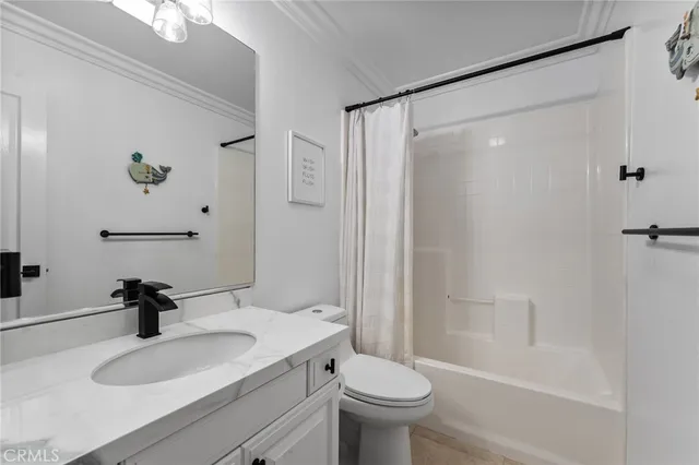 a bed room with a bed and a large mirror