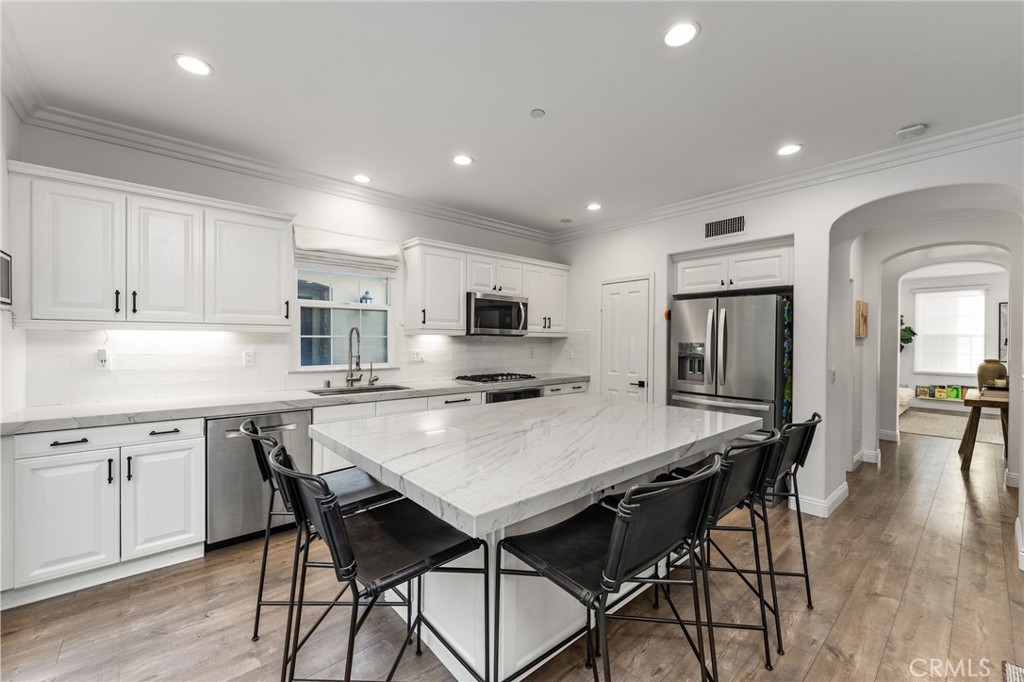 10 Bower Tree Irvine, CA 92603 - Photo 6 of 37 a kitchen with a table and chairs in it