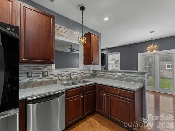 a kitchen with a sink and a refrigerator