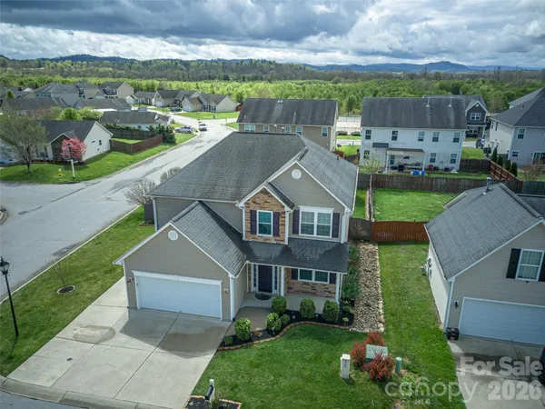 an aerial view of a house with a garden
