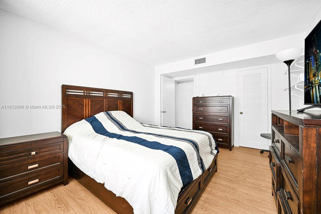 18041 Biscayne Boulevard, Unit 1201 Aventura, FL 33160 - Photo 11 of 42 Comfortable secondary bedroom with natural light and contemporary finishes, perfect for guests or flexible living.