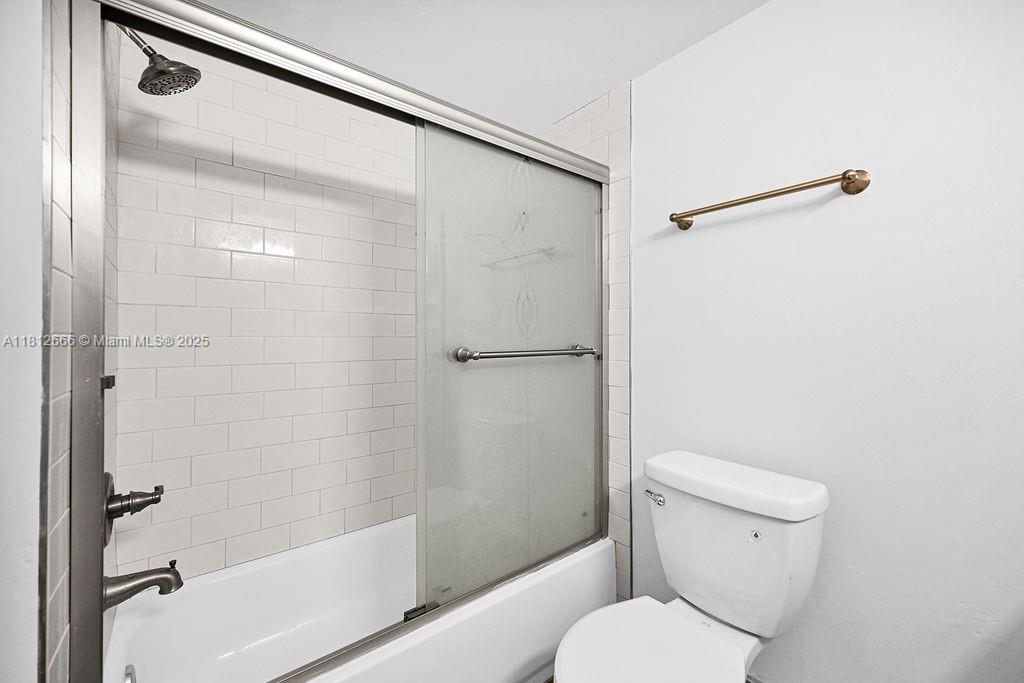 18041 Biscayne Boulevard, Unit 1201 Aventura, FL 33160 - Photo 16 of 42 Contemporary bathroom with tub/shower combo, elegant finishes, and calming neutral tones.