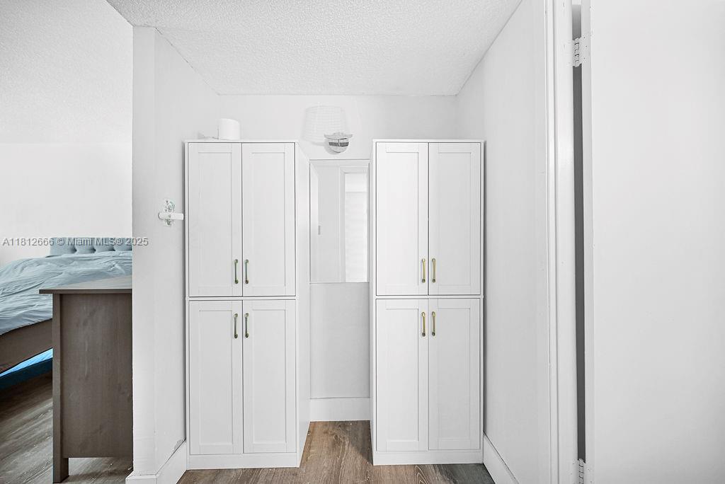 18041 Biscayne Boulevard, Unit 1201 Aventura, FL 33160 - Photo 9 of 42 Clean and spacious hallway with modern lighting, highlighting the condo’s airy and refreshed interior.