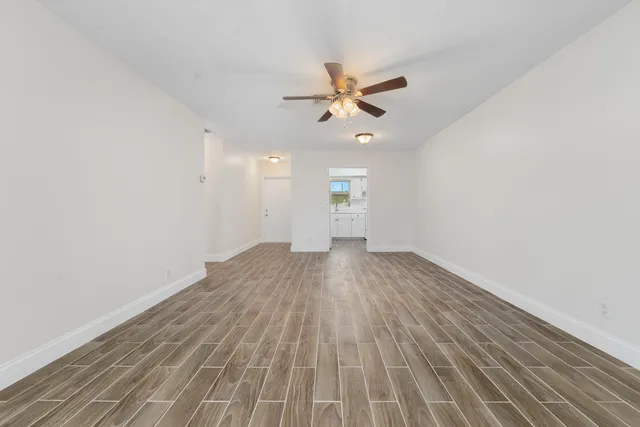 a kitchen with a sink cabinets and a refrigerator