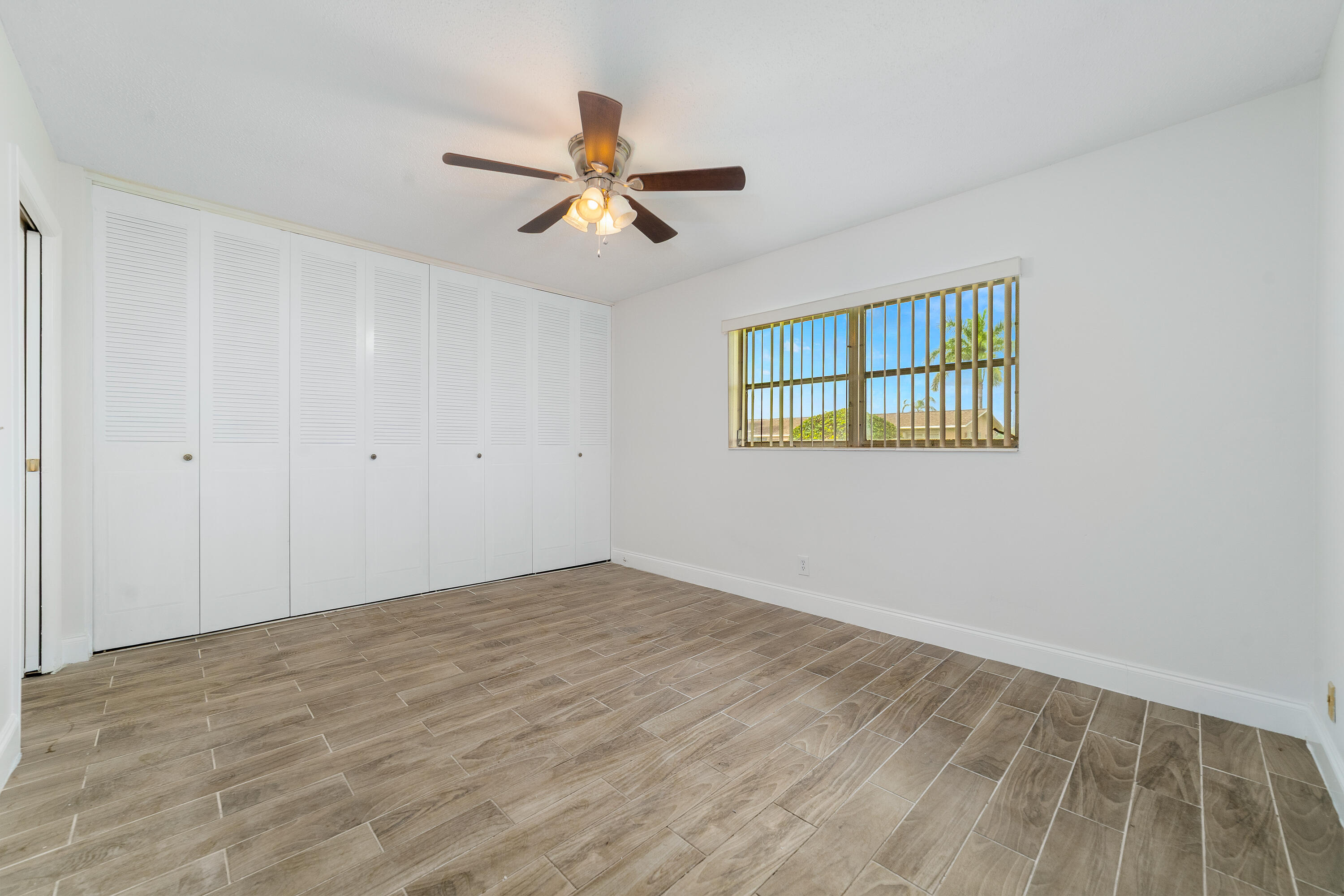 2567 Dudley Drive West, Unit F West Palm Beach, FL 33415 - Photo 19 of 41 a view of an empty room with a window
