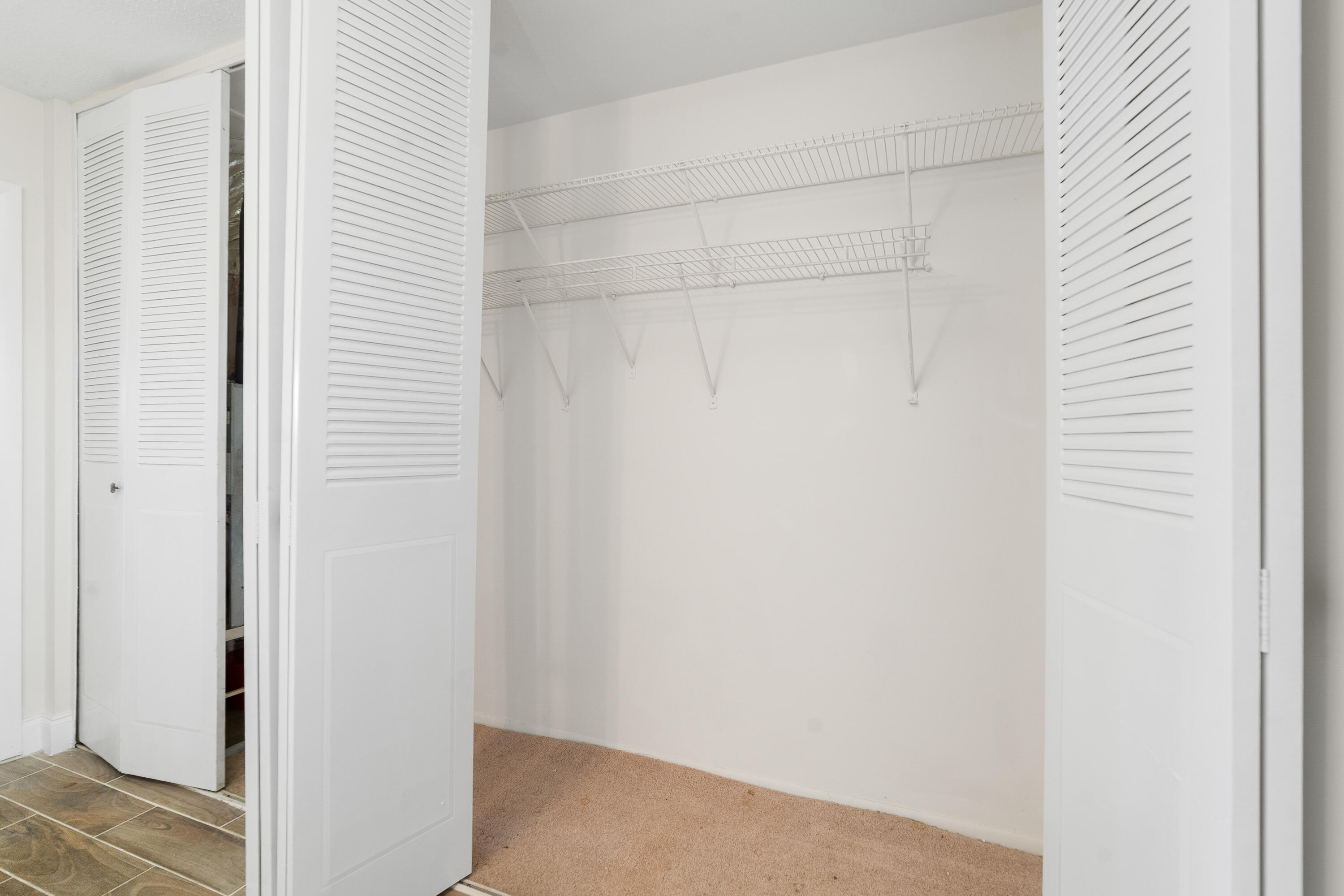 2567 Dudley Drive West, Unit F West Palm Beach, FL 33415 - Photo 21 of 41 a view of a hallway