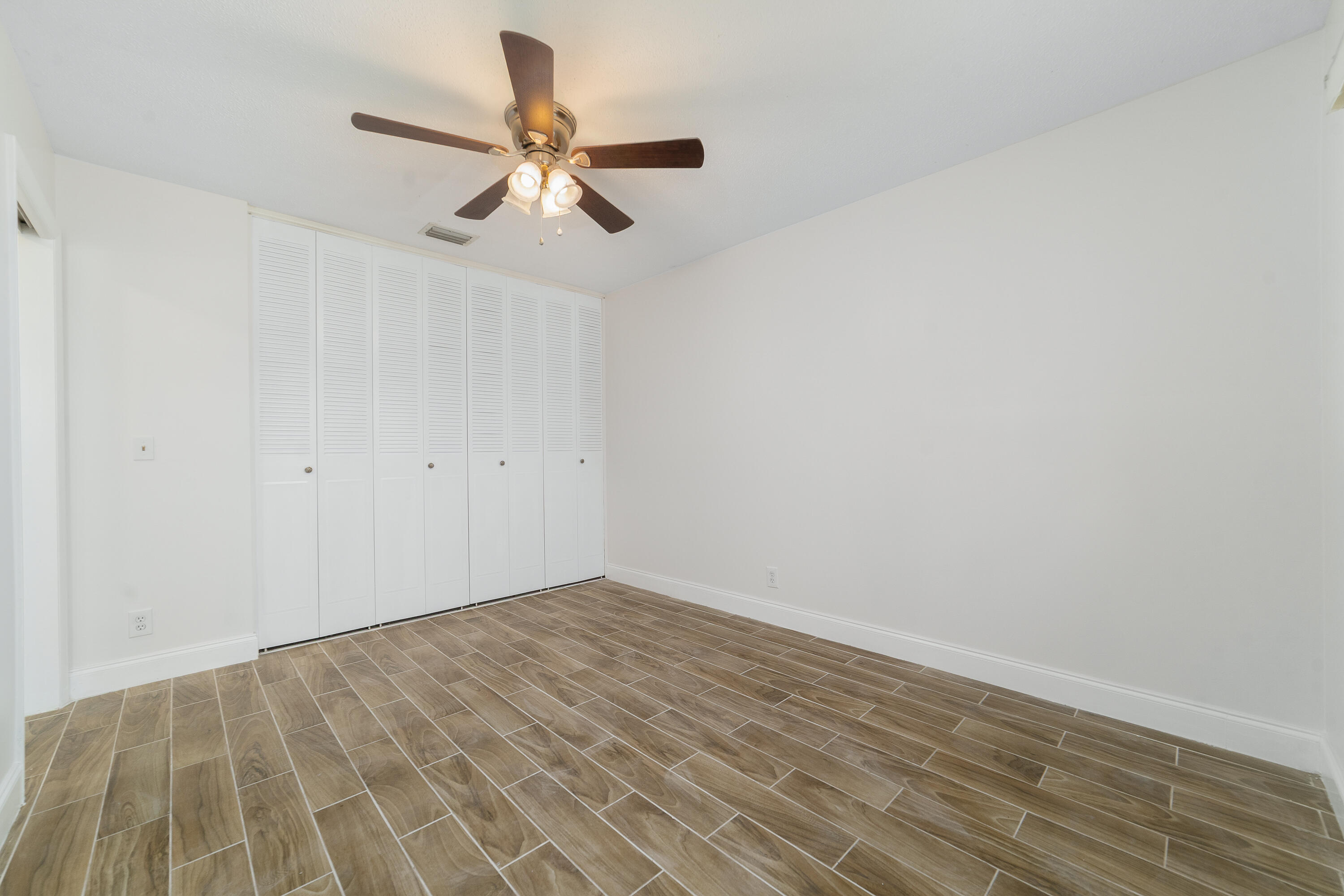 2567 Dudley Drive West, Unit F West Palm Beach, FL 33415 - Photo 24 of 41 wooden floor in a room