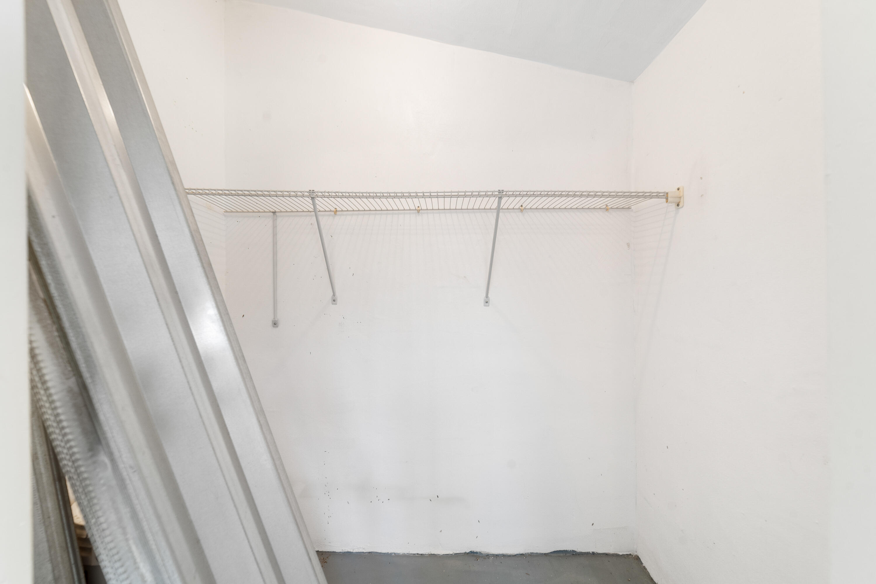 2567 Dudley Drive West, Unit F West Palm Beach, FL 33415 - Photo 30 of 41 a view of small space with racks on the wall