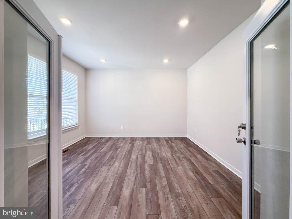 9213 Moldova Road Chesterfield, VA 23832 - Photo 14 of 51 an empty room with wooden floor and windows
