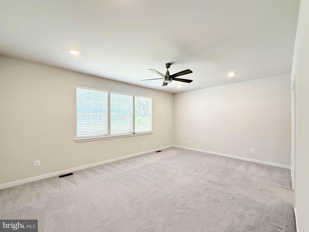 9213 Moldova Road Chesterfield, VA 23832 - Photo 22 of 51 an empty room with windows and fan